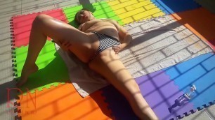 Touch pussy outdoors&period; Attractive lady is sunbathing on the roof of hotel